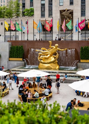 Modern outdoor plaza with people dining and gathering