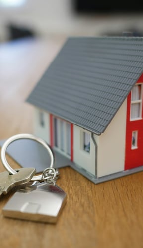 House model with keys on a desk