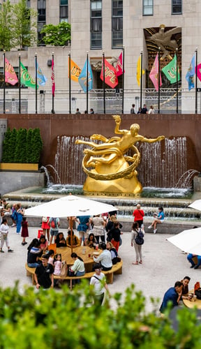 Modern outdoor plaza with people dining and gathering