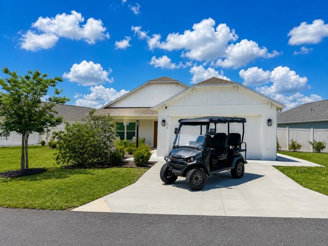 Golf cart parked in driveway